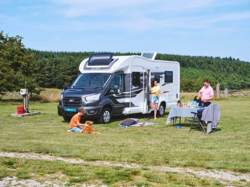 swift motorhome in the sun with family